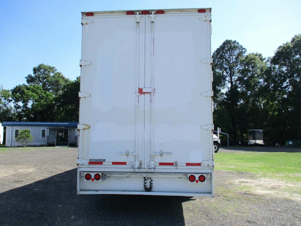 1999 Kentucky 48 DROP FRAME WITH 7 CURBSIDE DOORS